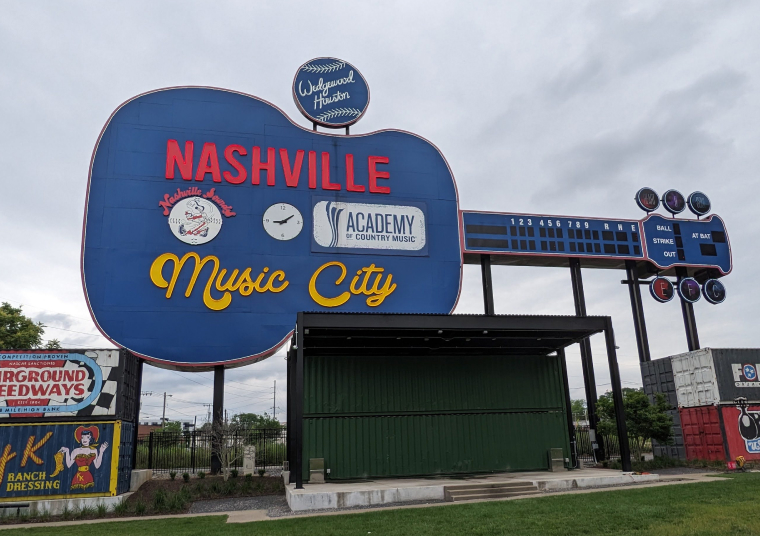 Iconic guitar-shaped Nashville Music City sign highlighting impactful work of a branding agency in crafting memorable brand identities