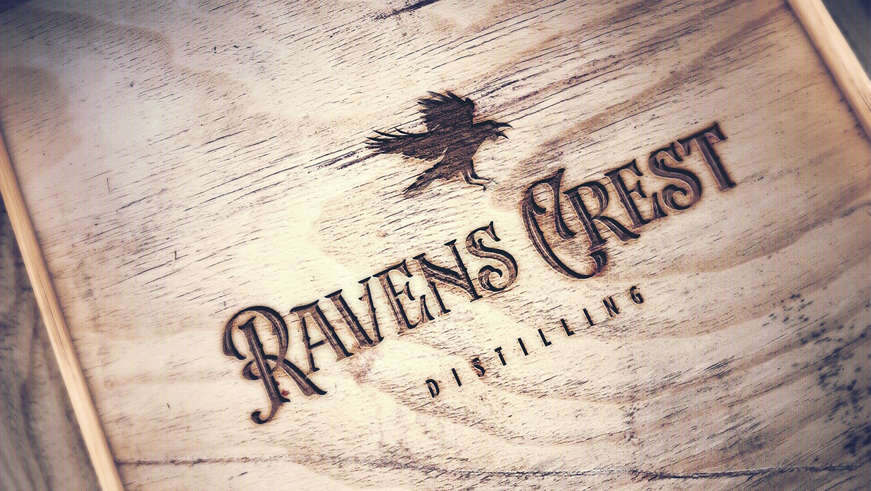 Ravens Crest Branding applied to wooden texture